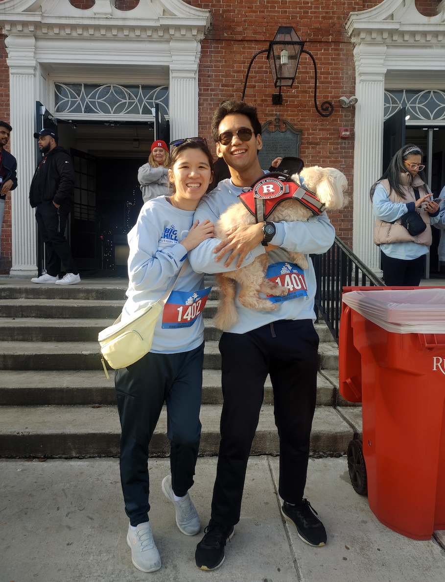 Image of Rutgers Alumni at Big Chill 5k posing with dog