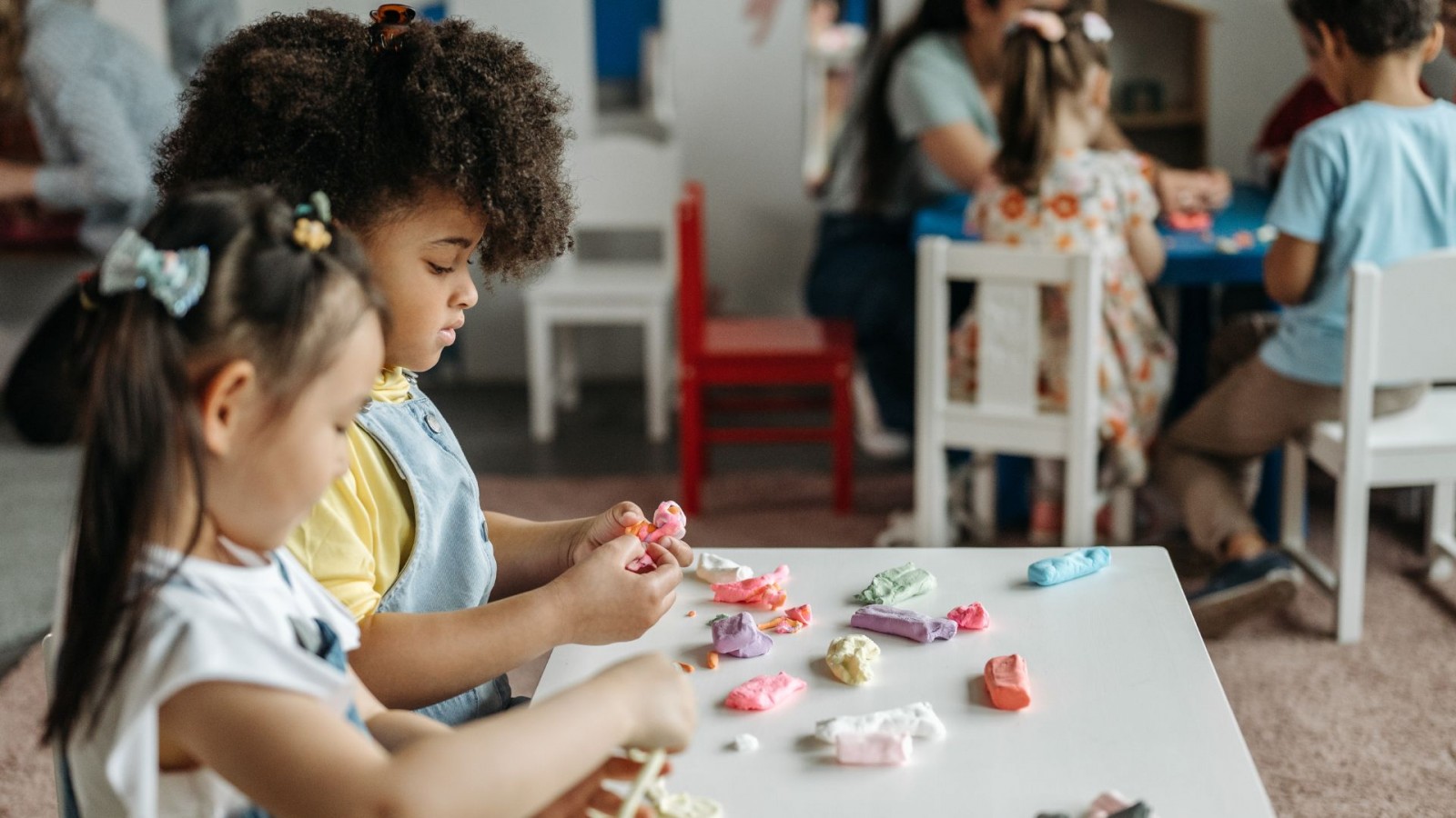 Image of two children playing with dough