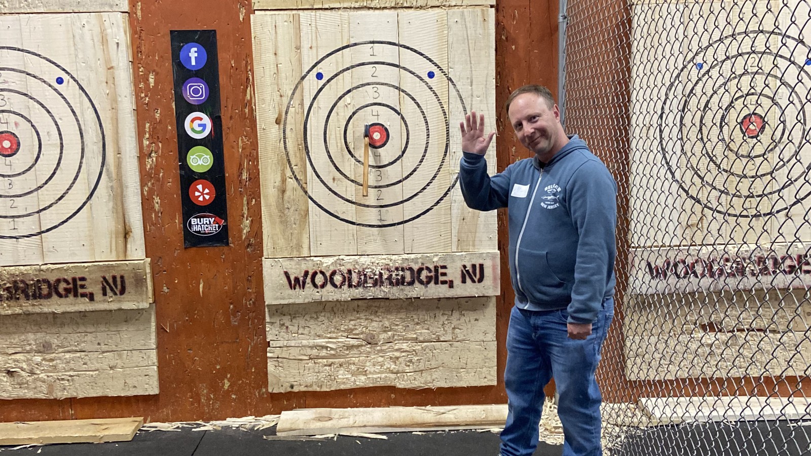 SMLR Alumna standing next to bulls-eye