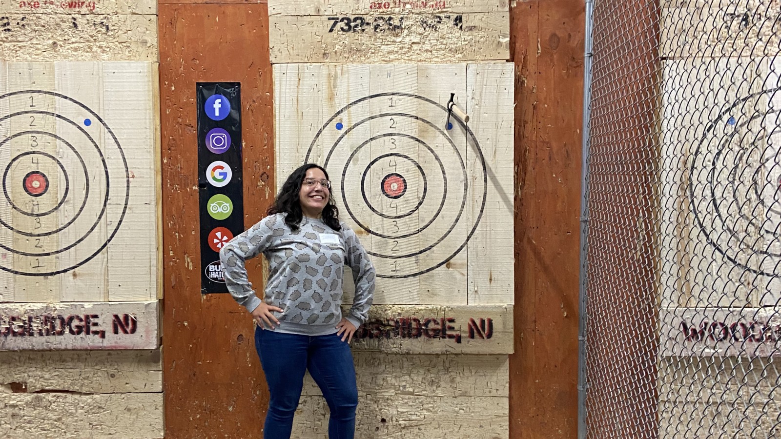 SMLR Alumna standing next to bulls-eye