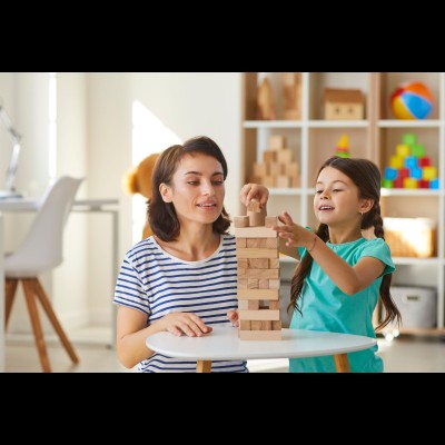 Image of woman and child playing with wooden blocks