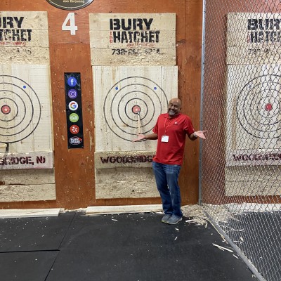 SMLR Alumna standing next to bulls-eye