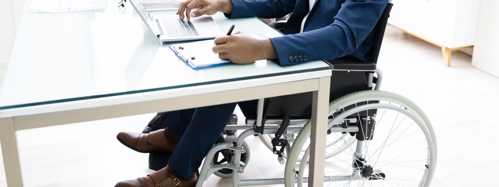 photo of person in a wheelchair in an office